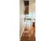 Hallway area featuring wood floors, recessed lighting, and pull-down attic access ladder at 1818 N Cornell Ave, Indianapolis, IN 46202