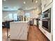 Open-concept kitchen features a large island with a marble countertop and stainless steel appliances at 1818 N Cornell Ave, Indianapolis, IN 46202