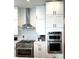 Well-equipped kitchen with stainless steel appliances and white cabinetry at 1818 N Cornell Ave, Indianapolis, IN 46202