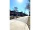 Neighborhood street view featuring a walking path, sidewalks, and variety of residential homes at 1818 N Cornell Ave, Indianapolis, IN 46202