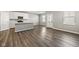 Open-concept living room boasting hardwood floors, neutral colors and a kitchen with stainless steel appliances at 2061 W 171St St, Westfield, IN 46074