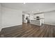 Spacious open-concept living area with hardwood floors and a modern kitchen with stainless steel appliances at 2061 W 171St St, Westfield, IN 46074