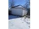 Exterior view of the garage with snow on the ground at 207 E Broadway St, Alexandria, IN 46001