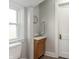 Bathroom with a new vanity, window, and toilet at 211 Jones St, Columbus, IN 47201