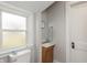 A bathroom with a new vanity, window, and toilet at 211 Jones St, Columbus, IN 47201
