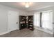 Comfortable bedroom with hardwood floors, a ceiling fan, and ample natural light, offering a serene space for rest at 211 Jones St, Columbus, IN 47201
