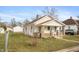 Charming single-Gathering home with white siding, brick accents, front porch, and a well-maintained yard at 211 Jones St, Columbus, IN 47201