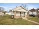 Well-maintained single Gathering home boasting classic architecture, featuring a covered front porch and inviting curb appeal at 211 Jones St, Columbus, IN 47201