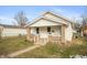 Cozy single Gathering home featuring a quaint front porch and neutral exterior, providing comfort and charm at 211 Jones St, Columbus, IN 47201