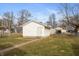 Exterior view of detached garage with a fenced yard at 211 Jones St, Columbus, IN 47201