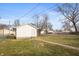 Exterior view of detached garage with a fenced yard at 211 Jones St, Columbus, IN 47201