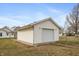 Detached garage with a driveway and fenced yard at 211 Jones St, Columbus, IN 47201