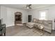 Spacious living room featuring hardwood floors, a ceiling fan, and open floor plan, creating a versatile living space at 211 Jones St, Columbus, IN 47201