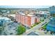 Aerial view of an apartment complex with a parking area and neighborhood views at 230 E 9Th St # 506, Indianapolis, IN 46204