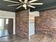 Spacious bedroom with hardwood floors, brick accent wall, and mirrored closet at 230 E 9Th St # 506, Indianapolis, IN 46204