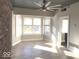 Bright living room features hardwood floors, brick accent wall, and large windows at 230 E 9Th St # 506, Indianapolis, IN 46204