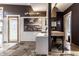 Well-lit bathroom featuring a desk area, tiled walls, and modern fixtures creating a serene and functional space at 2417 E 80Th E St, Indianapolis, IN 46240