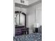 Bedroom featuring a full bed with grey bedding, a purple dresser and a large mirror at 2417 E 80Th E St, Indianapolis, IN 46240