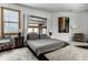 Comfortable bedroom with a queen-sized bed, stylish decor, soft rug, and natural light, perfect for relaxation at 2417 E 80Th E St, Indianapolis, IN 46240