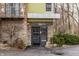 Modern home's welcoming front entrance with stone accents, sleek door, and tidy landscaping at 2417 E 80Th E St, Indianapolis, IN 46240