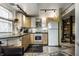 Cozy Kitchen with light wood cabinets, black countertops, and open layout at 2417 E 80Th E St, Indianapolis, IN 46240
