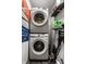 Efficient laundry area features stacked washer and dryer, maximizing space in a compact design at 2417 E 80Th E St, Indianapolis, IN 46240
