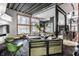 Open-concept living room with industrial ceilings, sleek furniture, and large windows at 2417 E 80Th E St, Indianapolis, IN 46240