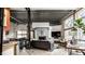 Spacious living room with fireplace, floor to ceiling windows, and dining area at 2417 E 80Th E St, Indianapolis, IN 46240