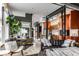 Open-concept living room featuring modern furnishings, a large window, and an open view to the kitchen at 2417 E 80Th E St, Indianapolis, IN 46240
