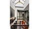 Stylish loft featuring a multi-story mezzanine with iron railings and a skylight, creating a unique and airy living space at 2417 E 80Th E St, Indianapolis, IN 46240