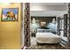 Modern bedroom features pendant lighting, neutral tones, and a partitioned wall for added privacy at 2417 E 80Th E St, Indianapolis, IN 46240