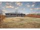 View of large fenced backyard with fire pit at 2625 15Th St, Columbus, IN 47201