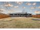 Backyard featuring fenced yard, fire pit and trampoline at 2625 15Th St, Columbus, IN 47201