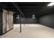 View of unfinished basement with painted concrete floor and exposed ceiling at 2625 15Th St, Columbus, IN 47201