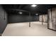 Unfinished basement featuring painted concrete floor and exposed ceiling at 2625 15Th St, Columbus, IN 47201