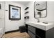 Modern bathroom features new vanity, toilet, and updated tile at 2625 15Th St, Columbus, IN 47201