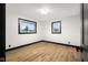 Bright bedroom features hardwood floors, fresh paint, and double-pane windows at 2625 15Th St, Columbus, IN 47201