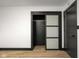 Modern bedroom featuring a closet with sliding doors and hardwood floors at 2625 15Th St, Columbus, IN 47201