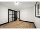 Modern bedroom featuring hardwood floors, closet, and new paint at 2625 15Th St, Columbus, IN 47201