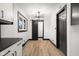 Dining area with a modern light fixture and sliding barn door detail at 2625 15Th St, Columbus, IN 47201