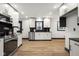Fully renovated kitchen with new cabinets, stainless steel appliances, and recessed lighting at 2625 15Th St, Columbus, IN 47201