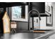Close-up of a kitchen sink and countertop, featuring modern design elements at 2625 15Th St, Columbus, IN 47201
