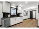 Bright kitchen featuring stainless steel appliances and a modern light fixture at 2625 15Th St, Columbus, IN 47201