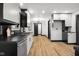 Kitchen features stainless steel appliances and black countertops at 2625 15Th St, Columbus, IN 47201