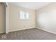 A bedroom with gray carpet and a single window at 3130 Elizabeth St, Indianapolis, IN 46234