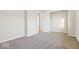 A bedroom with gray carpet and a closet with a white sliding door at 3130 Elizabeth St, Indianapolis, IN 46234