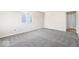 Bedroom showing carpet, a window, and neutral wall color at 3130 Elizabeth St, Indianapolis, IN 46234