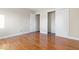 A bedroom with hardwood flooring and a closet with sliding doors at 3130 Elizabeth St, Indianapolis, IN 46234