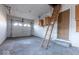 An empty garage with a ladder at 3130 Elizabeth St, Indianapolis, IN 46234