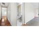 Hallway leading to a bathroom with white tiling at 3130 Elizabeth St, Indianapolis, IN 46234